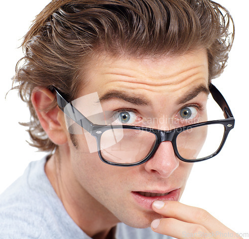 Image of Surprised, portrait and man in glasses with shock, worry or anxiety closeup on white studio background. Omg, wow or wtf and nerd, geek reaction and fear, stress, shocked expression and isolated face