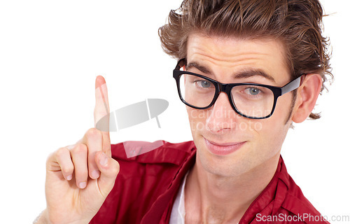 Image of Isolated, portrait and man pointing a finger up and person in glasses, hand gesture and advice on white studio background. Serious, geek or nerd eyewear and point for one, yes or correct choice