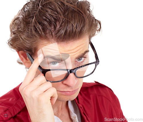 Image of Doubt, peering and glasses with portrait of man in studio for questions, thinking and curious. Skeptical, confused and serious with closeup face of male model isolated on white background for review