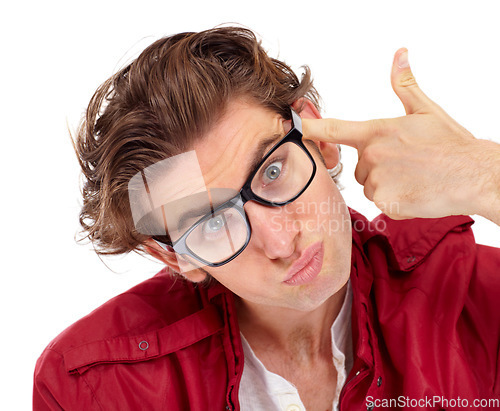 Image of Finger gun, portrait and man in a studio with a comic silly, funny and goofy face expression. Crazy, quirky and male model with glasses posing with a shoot gesture isolated by a white background.