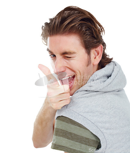 Image of Pointing, wink and portrait of man in studio for finger gun, approval and choice. Confident, happy and smile with male and hand gesture isolated on white background for success, yes and thank you