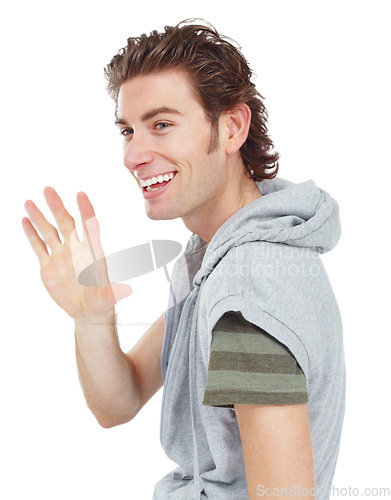 Image of Happy, casual and man waving in a studio for greeting with a stylish and trendy outfit. Happiness, smile and male model with fashion or style doing a hello hand gesture isolated by a white background