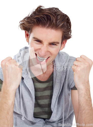 Image of Yes, excited and portrait of a man with success and fist in a studio with happiness from winning. Isolated, white background and male model face happy about winner celebration with a smile and win