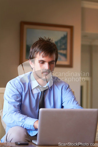 Image of Focus, laptop and business man in office for research, communication and website. Technology, internet and corporate email with male employee typing on computer for online, connection and networking