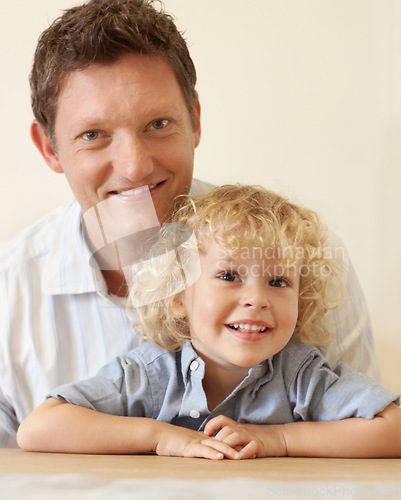 Image of Happy family, love and portrait of father with smiling son at their home. Happiness or quality time, bonding or togetherness and wellness of parent with young child enjoying indoor fun in living room