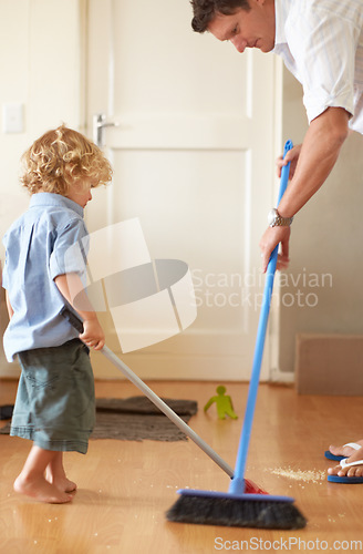 Image of Father with boy kid sweep up mess, family cleaning together and help with broom and dustpan. Hygiene, chores and house work with man and kid bonding, working together and helping with dirt on floor