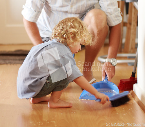 Image of Father with boy child sweeping up mess, family cleaning together and help with broom and dustpan. Hygiene, chores and house work, man and kid bonding, working together and helping with dirt on floor