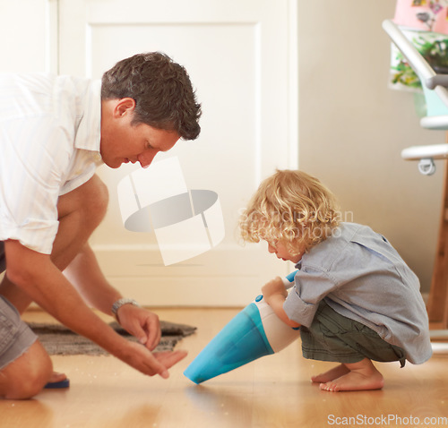 Image of Boy, father and vacuum floor with learning, support and cleaning in family home together with care. Man, male child and teaching life skills with love, bonding and development for clean flooring