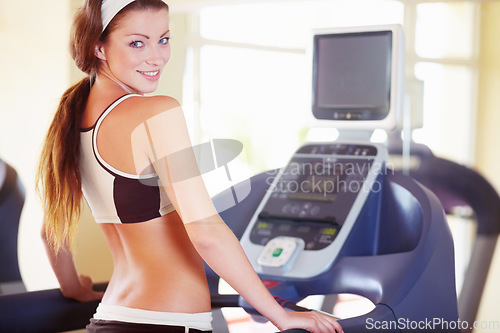 Image of Woman, exercise portrait and happy on treadmill for fitness, wellness and health in gym with excited face. Girl runner, running machine and happiness for body goal, workout or training for self care