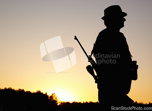 Image of Hunting at sunset, man with rifle and mockup in nature to hunt game for sport hobby on safari adventure. African sky, silhouette and mock up space, hunter with gun in bush and evening setting sun.