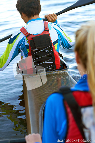 Image of Back, man and woman on water in kayak for rowing, sport and fitness for health, wellness and teamwork. Rowing team, boat and adventure for sports, freedom and exercise on river, dam or lake in nature