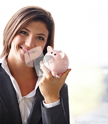 Image of Business woman, piggybank and portrait with smile for savings, money planning and personal finance goal. Female financial advisor, happiness and small start for banking, investment or building wealth