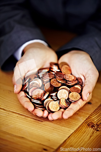 Image of Cupped hands, coins and saving money for investing, planning and personal finance goal in office. Financial advisor, holding cash or currency for banking, investment or building wealth at workplace