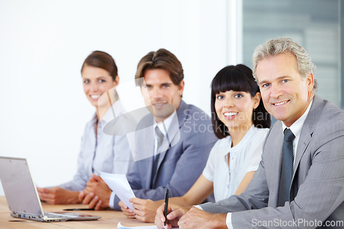 Image of Portrait, collaboration and a team of business people sitting in the boardroom for a planning meeting. Teamwork, strategy or training with corporate men and women working together in the office