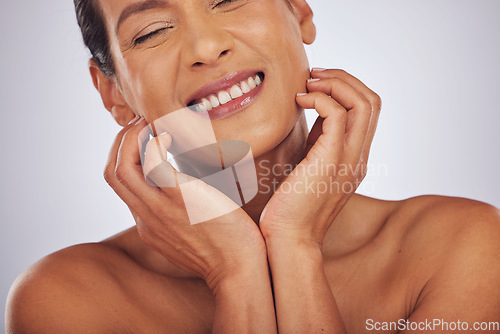 Image of Self care, dermatology and mature woman with skincare, makeup and aesthetic on a studio background. Female person, face or model with luxury cosmetics, natural beauty or wellness with a glow or smile