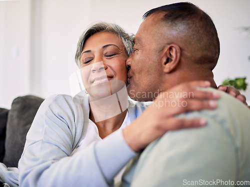 Image of Love kiss, home and face of elderly couple, affection and enjoy quality time together, support or retirement. Romantic bond, marriage care or senior husband, wife or people relax for weekend wellness