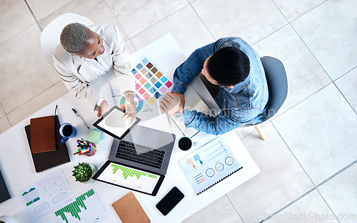 Image of Top view, business people and laptop for web design at desk with teamwork, blank tablet and marketing. Man, woman and planning for ux with chart, data analytics and collaboration at tech startup