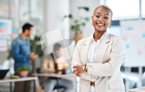 Image of Portrait, smile and black woman in modern office with arms crossed, leadership and startup business. Professional management, happiness and confident African businesswoman in corporate work space.