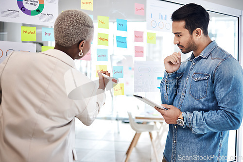 Image of Man, woman and glass for writing, planning or brainstorming with tablet, thinking and goals. Young business people, moodboard or notes for teamwork, stats or chart at startup for marketing strategy