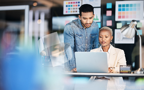 Image of Laptop, designer collaboration and business people reading, problem solving and working on creative design deadline. Diversity partnership, startup teamwork and professional team review research plan