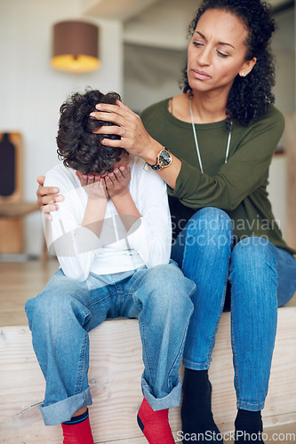 Image of Sad, depression and a mother with crying child together in stairs for comfort, love and support. Depressed, empathy and anxiety or mental health problem of a kid with a woman in a family home
