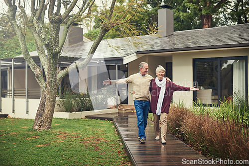 Image of Happy senior couple, garden and walk with smile, hug and together with love, bonding and freedom in winter. Old woman, happy man and embrace in backyard in retirement, nature and outdoor in morning