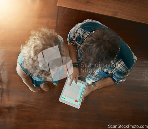 Image of Teamwork, collaboration or employees with tablet reading online report in meeting for analysis in top view. Statistics data analysis, screen or above of man and woman checking stats in startup office