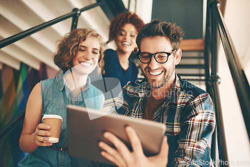 Image of Teamwork, designers or happy people with tablet or online report in meeting for analysis on steps. Smile, internet or group of creative employees in startup modern office on stairs for a digital news