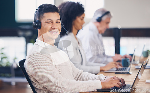 Image of Portrait, laptop and call center with a man consultant working in a telemarketing office for support. Customer service, contact us and computer with a male employee consulting using a headset