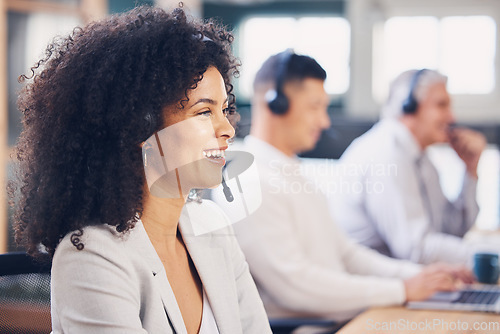 Image of Happy, service and black woman in a call center for consulting, help and communication. Contact, talking and African customer support employee smiling for sales, advice and speaking for telemarketing