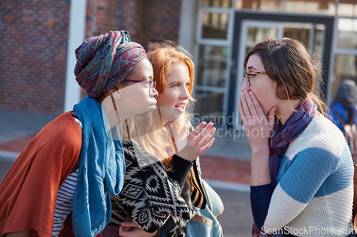 Image of Youll never guess what I just heard. Cropped shot of a group of university students hanging out between class.