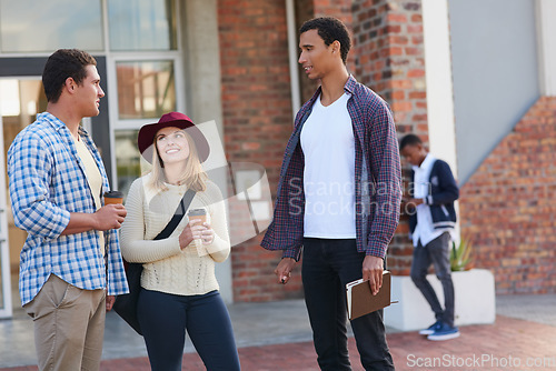 Image of Catching up before class. Cropped shot of a group of university students hanging out between class.