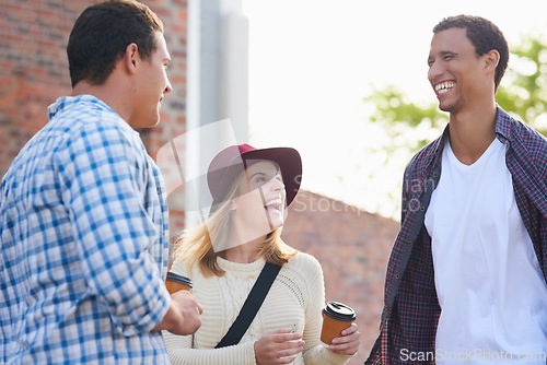 Image of Cherishing their student years together. Cropped shot of a group of university students hanging out between class.