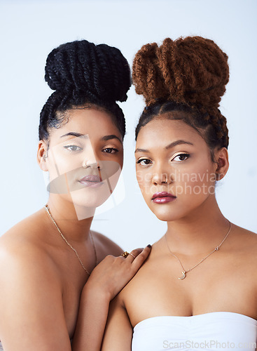 Image of Theyre both ravishing beauties. Studio shot of two beautiful young women posing against a grey background.