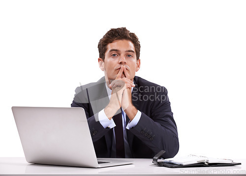 Image of Managing his diary. A pensive young businessman sitting in front of his laptop.