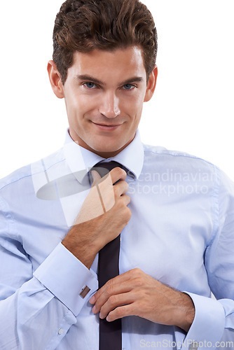 Image of Dressed for success. A handsome young businessman adjusting his tie.