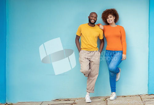 Image of Interracial, portrait and couple on a city wall for travel, holiday and happy in Germany. Smile, relax and black man and woman standing on a mockup background downtown during a vacation together
