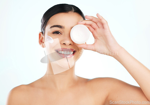 Image of Skincare, face and woman with cream container in studio isolated on a white background. Portrait, dermatology creme or happy female model with beauty cosmetics, lotion or moisturizer for healthy skin