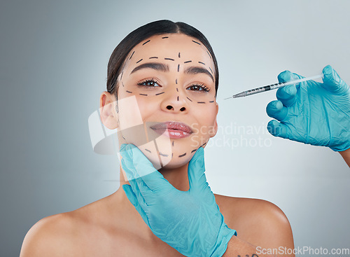 Image of Portrait, plastic surgery and botox with a woman in studio on a gray background for a facelift injection. Doctor, medical and improvement with hands in gloves holding a syringe for facial collagen