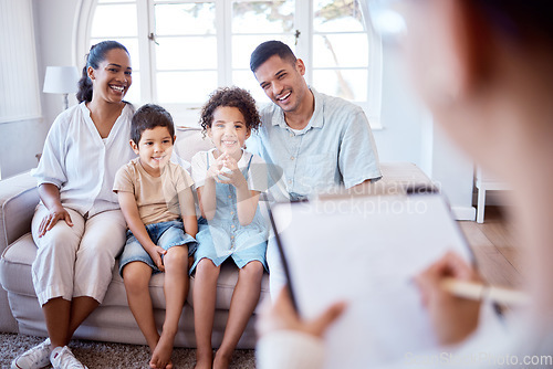 Image of Parents, children and psychology with family therapy, smile and together on sofa, support and discussion. Young kids, mom and dad on couch with psychologist, listening and talking for mental health