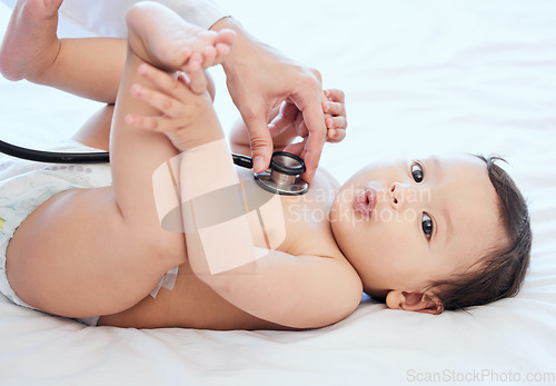 Image of Stethoscope, health and baby in a clinic, checkup and wellness with heartbeat, growth and cardiology. Closeup, young person and infant with medical issue, appointment and doctor with a child and care