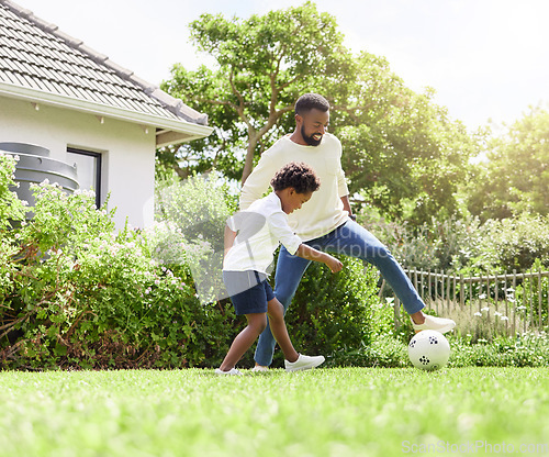 Image of Soccer, father and happy kid on garden with sun, sport learning and goal kick together. Lawn, fun game and black family with football on grass with youth, sports development and bonding on field