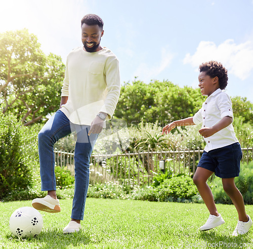 Image of Soccer, dad and kid on a summer garden with exercise, sport learning and goal kick together. Lawn, fun game and black family with football on grass with youth, sports development and bonding on field