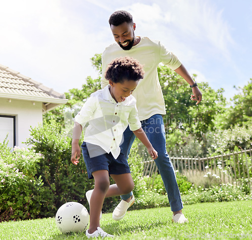 Image of Soccer game, dad and happy kid on a garden with exercise, sport learning and goal kick together. Lawn, fun father and black family with football on grass with youth, sports development and bonding