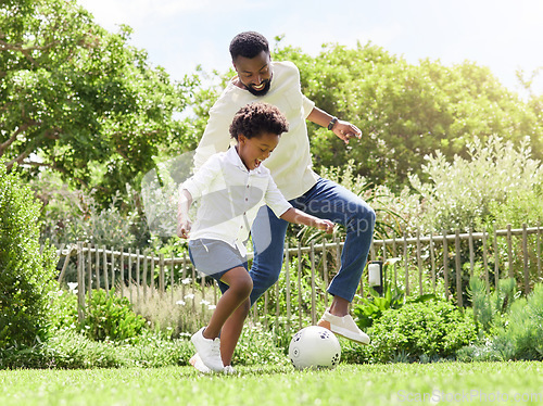 Image of Soccer, happy dad and kid on a garden with exercise, sport learning and goal kick together. Lawn, fun game and black family with football on grass with youth, sports development and bonding on field