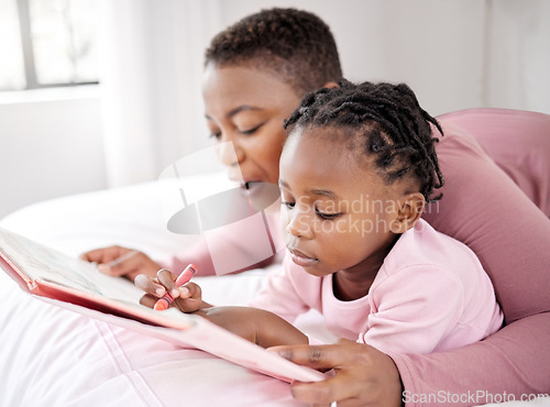 Image of Love, reading book and mother with child in bed for learning, drawing and fun at home. Storytelling, family and parent with girl in bedroom with notebook for literature, art or writing in their house