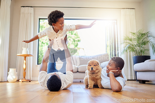 Image of Dad, mother and home playing airplane together with happiness and puppy with smile. House, family and support of a mom, father and young child with dog and animal in living room having fun on floor