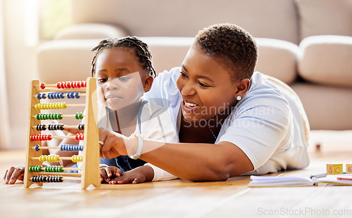 Image of Learning, help and abacus with mother and daughter in living room for math, education and homeschooling. Numbers, support and study with black woman and girl in family home for teaching and knowledge