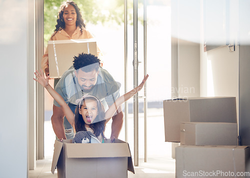 Image of Happy family, boxes and child playing in new home with smile, excitement and mortgage on property investment. Man, woman and girl in box in house, moving and investing in real estate, love and future