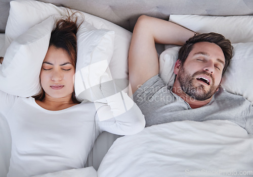 Image of Snoring, stress and above angry woman with sleeping man in bed, unhappy and frustrated, insomnia and crisis. Bedroom, fail and top view of lady with noise, issue and annoyed by snore or sleep apnea